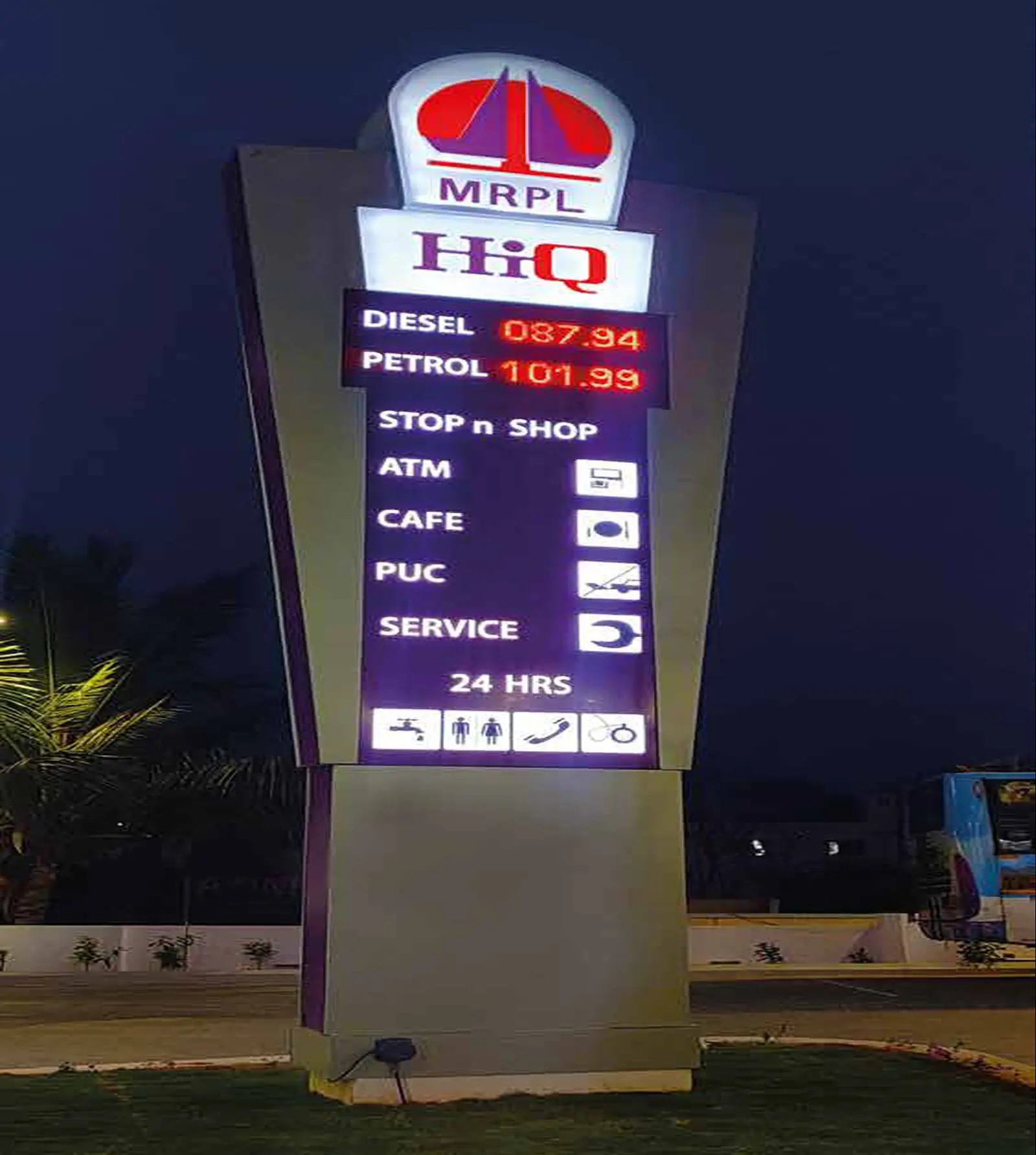 MRPL HiQ pylon illuminated at night with LED price display